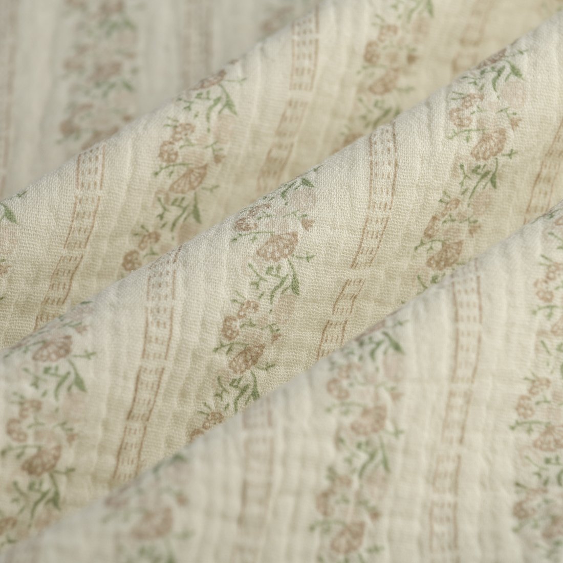 Tissu double gaze fleur en ligne beige écru