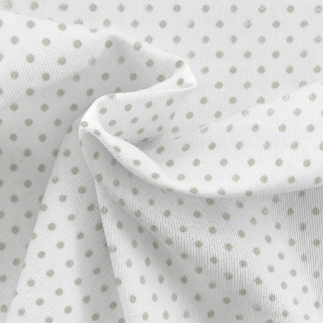 Tissu piqué de coton motifs pois vert fond écru