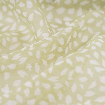 Tissu mousseline polyester tacheté kaki pâle