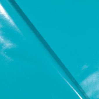 Toile cirée unie bleu turquoise roulée et sans plis