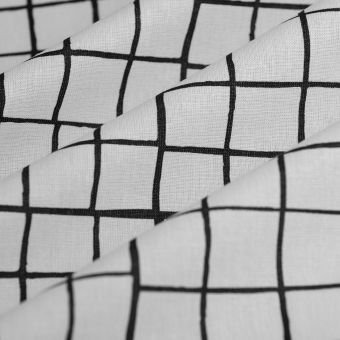 Tissu cretonne enduite carreaux irréguliers noir et blanc