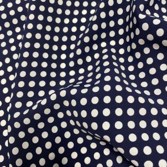 Tissu polyester à pois blanc fond bleu marine