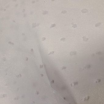 Tissu organza plumetis pompons blanc