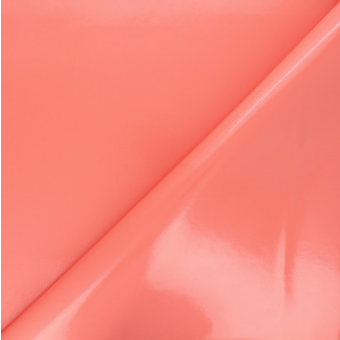 Toile cirée unie corail roulée et sans plis