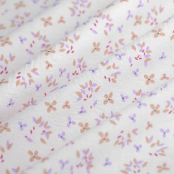 Tissu jersey coton extensible fleurettes écru mauve