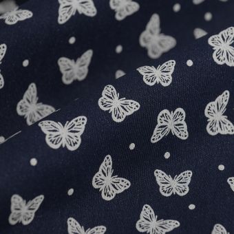 Tissu jean stretch papillons écru marine