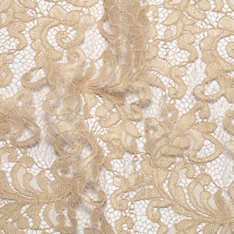 Tissu dentelle guipure arabesques bord festonné beige