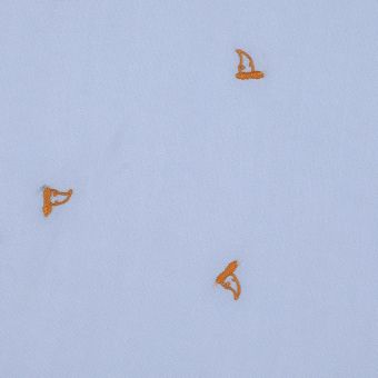 Tissu viscose bleu brodé tête de chien