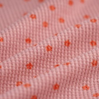 Tissu maille nid d'abeille polyester fleur folk rose