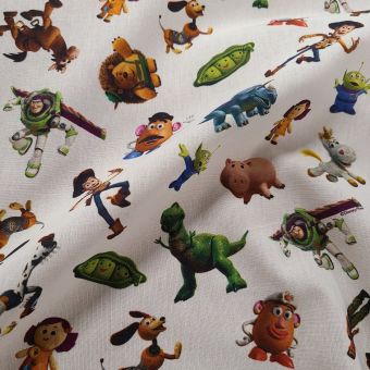 Tissu coton imprimé Toy Story écru