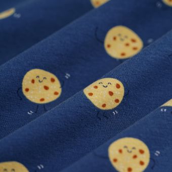 Tissu jersey cookies sourire fond bleu