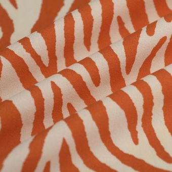Tissu crêpe polyester zèbre orange écru
