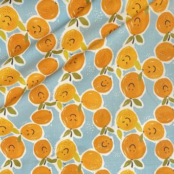 Tissu coton enduit imprimé orange smiley fond turquoise