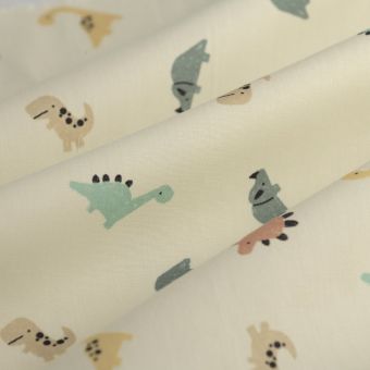 Tissu popeline coton dinos pastel