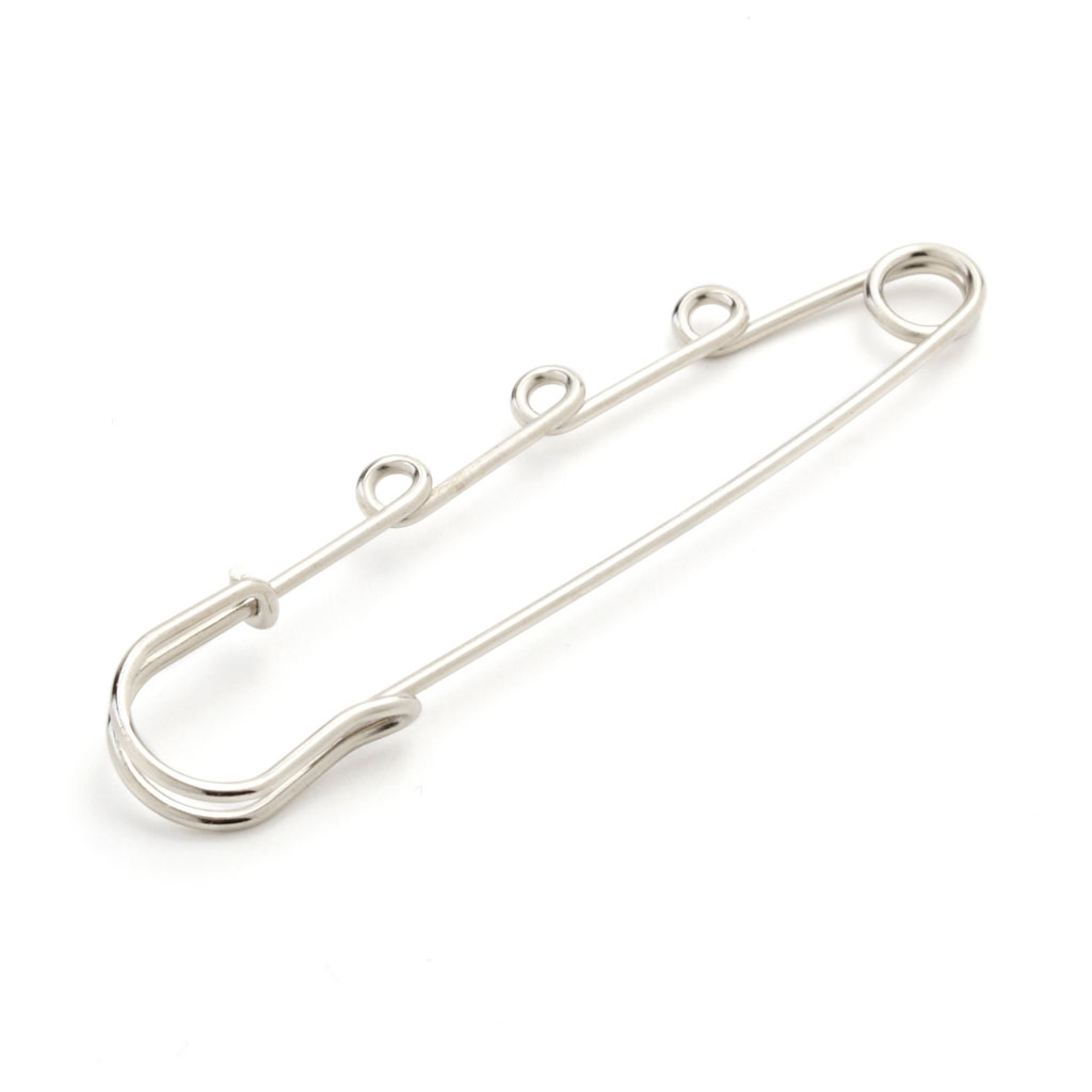 Epingle kilt argentée à volutes