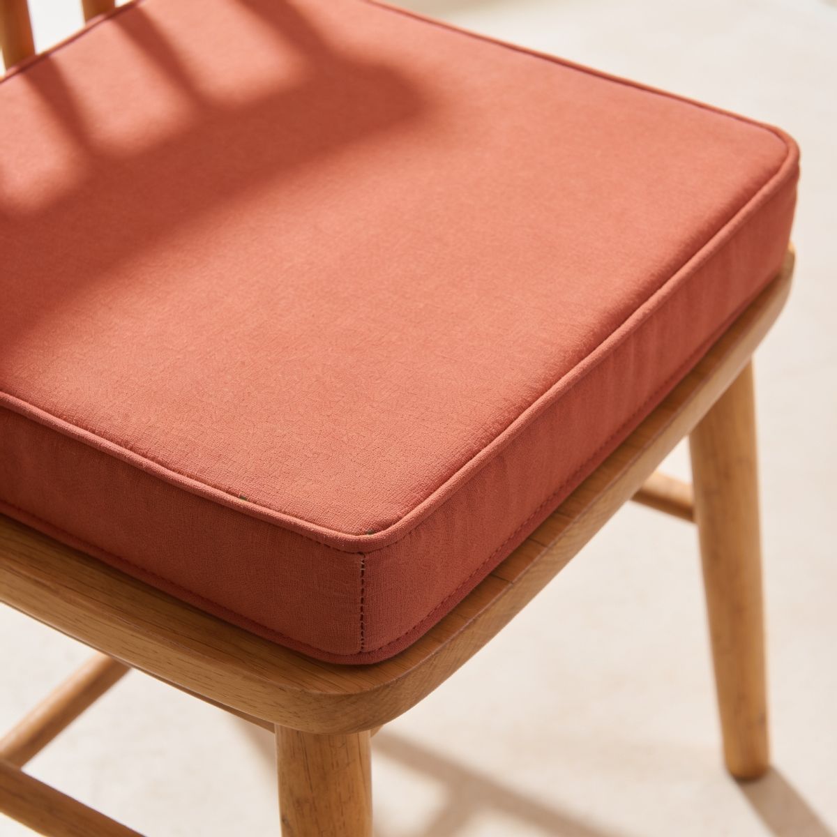 Coussin à bande rapportée